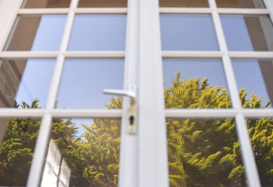 white metal framed glass window