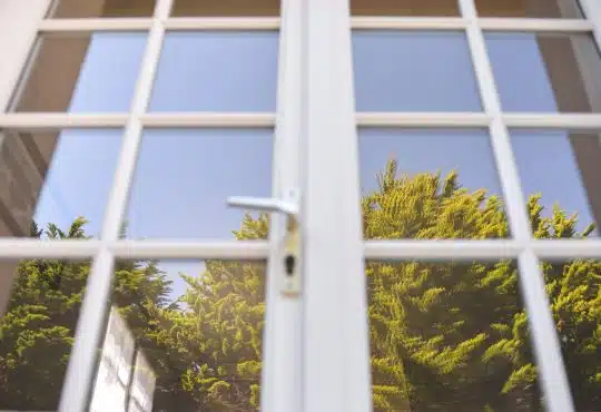white metal framed glass window